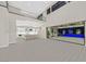Open living space with high ceilings, modern kitchen, and access to pool at 65 Garibaldi Way, Henderson, NV 89011
