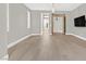 Spacious living area with hardwood floors and access to bedroom at 65 Garibaldi Way, Henderson, NV 89011
