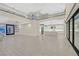 Open living space with high ceilings, modern kitchen, and access to pool at 65 Garibaldi Way, Henderson, NV 89011