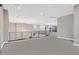 Spacious loft area with high ceilings and a modern chandelier at 65 Garibaldi Way, Henderson, NV 89011