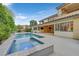 Resort-style pool and spa with expansive patio at 65 Garibaldi Way, Henderson, NV 89011