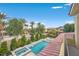 Luxury pool and spa with water features, viewed from a balcony at 65 Garibaldi Way, Henderson, NV 89011