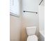 Bathroom featuring a toilet and towel rack, next to a shower stall at 7044 Stockton Dunes St, North Las Vegas, NV 89084