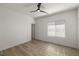 Spacious bedroom with wood-look floors and large window with blinds at 7230 N Decatur Blvd # 6, Las Vegas, NV 89131