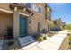 Teal front door with steps and desert landscaping at 7230 N Decatur Blvd # 6, Las Vegas, NV 89131