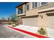 Attached garage with light tan door and red fire lane at 7230 N Decatur Blvd # 6, Las Vegas, NV 89131