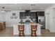 Modern kitchen with island, stainless steel appliances, and dark cabinets at 7230 N Decatur Blvd # 6, Las Vegas, NV 89131