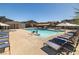 Community pool with plenty of lounge chairs for relaxation at 7230 N Decatur Blvd # 6, Las Vegas, NV 89131