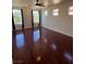 Bedroom featuring hardwood floors, neutral colored walls, and large windows for ample natural light at 7481 Benlomond Ave, Las Vegas, NV 89179