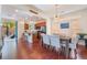 Dining area with hardwood floors and adjacent kitchen at 7481 Benlomond Ave, Las Vegas, NV 89179