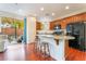 Bright kitchen with granite counters, island, and access to backyard patio at 7481 Benlomond Ave, Las Vegas, NV 89179