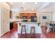 Spacious kitchen with granite countertops, island, and stainless steel appliances at 7481 Benlomond Ave, Las Vegas, NV 89179