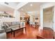 Open concept living and dining area with hardwood floors at 7481 Benlomond Ave, Las Vegas, NV 89179