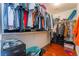 Spacious walk-in closet with built-in shelving, providing ample storage for clothes and accessories at 7481 Benlomond Ave, Las Vegas, NV 89179