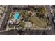 Aerial view showing community pool, park, and playground at 7660 Fabled Filigree St, Las Vegas, NV 89149