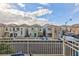 View of houses from a balcony overlooking the neighborhood at 7660 Fabled Filigree St, Las Vegas, NV 89149