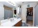 Bathroom with a vanity, shower and walk-in closet at 7660 Fabled Filigree St, Las Vegas, NV 89149
