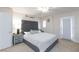 Main bedroom with a plush bed and ample space at 7660 Fabled Filigree St, Las Vegas, NV 89149