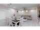 Dining area with table and chairs, adjacent to living room at 7660 Fabled Filigree St, Las Vegas, NV 89149
