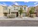 Two-story house with balcony, attached garage, and landscaping at 7660 Fabled Filigree St, Las Vegas, NV 89149