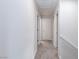 Clean carpeted hallway with doors leading to bedrooms and bathroom at 7660 Fabled Filigree St, Las Vegas, NV 89149
