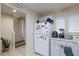 Kitchen with refrigerator, pantry and breakfast bar at 7660 Fabled Filigree St, Las Vegas, NV 89149