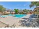 Inviting community pool with lounge chairs and covered seating at 7660 Fabled Filigree St, Las Vegas, NV 89149