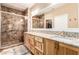 Bathroom boasts double vanity, granite counters, and walk-in shower at 7830 Lyrebird Dr, North Las Vegas, NV 89084