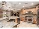 Modern kitchen with stainless steel appliances and granite counters at 7830 Lyrebird Dr, North Las Vegas, NV 89084