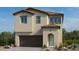 Two-story home with a brown garage door and teal front door at 80 Via Franello, Henderson, NV 89015