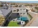 Overhead aerial view showcasing a modern pool, patio, and outdoor lounge area, perfect for entertaining at 82 Glade Hollow Dr, Las Vegas, NV 89135