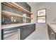 Modern bar area with dark wood cabinets, floating shelves, and under-cabinet lighting at 82 Glade Hollow Dr, Las Vegas, NV 89135