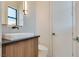 Stylish powder room featuring marble vessel sink, modern light fixture and beautiful fixtures at 82 Glade Hollow Dr, Las Vegas, NV 89135