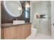 Bathroom with wood cabinets, granite countertop, vessel sink, and glass enclosed shower at 82 Glade Hollow Dr, Las Vegas, NV 89135