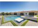 Stunning pool area with modern design, featuring a spa, and lush landscaping for a serene outdoor experience at 82 Glade Hollow Dr, Las Vegas, NV 89135