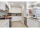 Modern kitchen with island, stainless steel appliances, and white cabinetry at 8255 Las Vegas Blvd # 121, Las Vegas, NV 89123