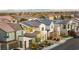 Aerial perspective showing a house among other homes and distant city view at 8290 Charleston Peak St, Las Vegas, NV 89166