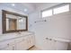 Bathroom with vanity, large mirror and toilet at 881 Stonehenge St, Las Vegas, NV 89110