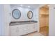 Double vanity bathroom with granite countertop and ample storage at 881 Stonehenge St, Las Vegas, NV 89110