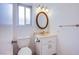 Clean bathroom with vanity, toilet, and mirror at 881 Stonehenge St, Las Vegas, NV 89110