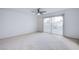 Spacious bedroom with ceiling fan and access to balcony at 881 Stonehenge St, Las Vegas, NV 89110