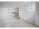 Bright dining room with chandelier and staircase at 881 Stonehenge St, Las Vegas, NV 89110