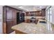 Kitchen boasts granite countertops and stainless steel appliances at 881 Stonehenge St, Las Vegas, NV 89110