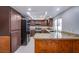 Kitchen with granite counters and dark cabinets at 881 Stonehenge St, Las Vegas, NV 89110