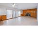 Living room with tile floor, fireplace, and patio doors at 881 Stonehenge St, Las Vegas, NV 89110