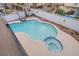 Inviting freeform pool with spa and ample patio space at 881 Stonehenge St, Las Vegas, NV 89110