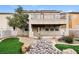House with backyard featuring artificial turf and a rock garden at 989 Crescent Falls St, Henderson, NV 89011