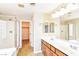 Bathroom with double sinks, and separate shower and tub at 989 Crescent Falls St, Henderson, NV 89011