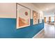 Bright hallway with teal accent wall and modern art at 10164 Mulberry Ridge St # 42, Las Vegas, NV 89141