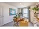 Bright home office with wood desk and accent wall at 10164 Mulberry Ridge St # 42, Las Vegas, NV 89141